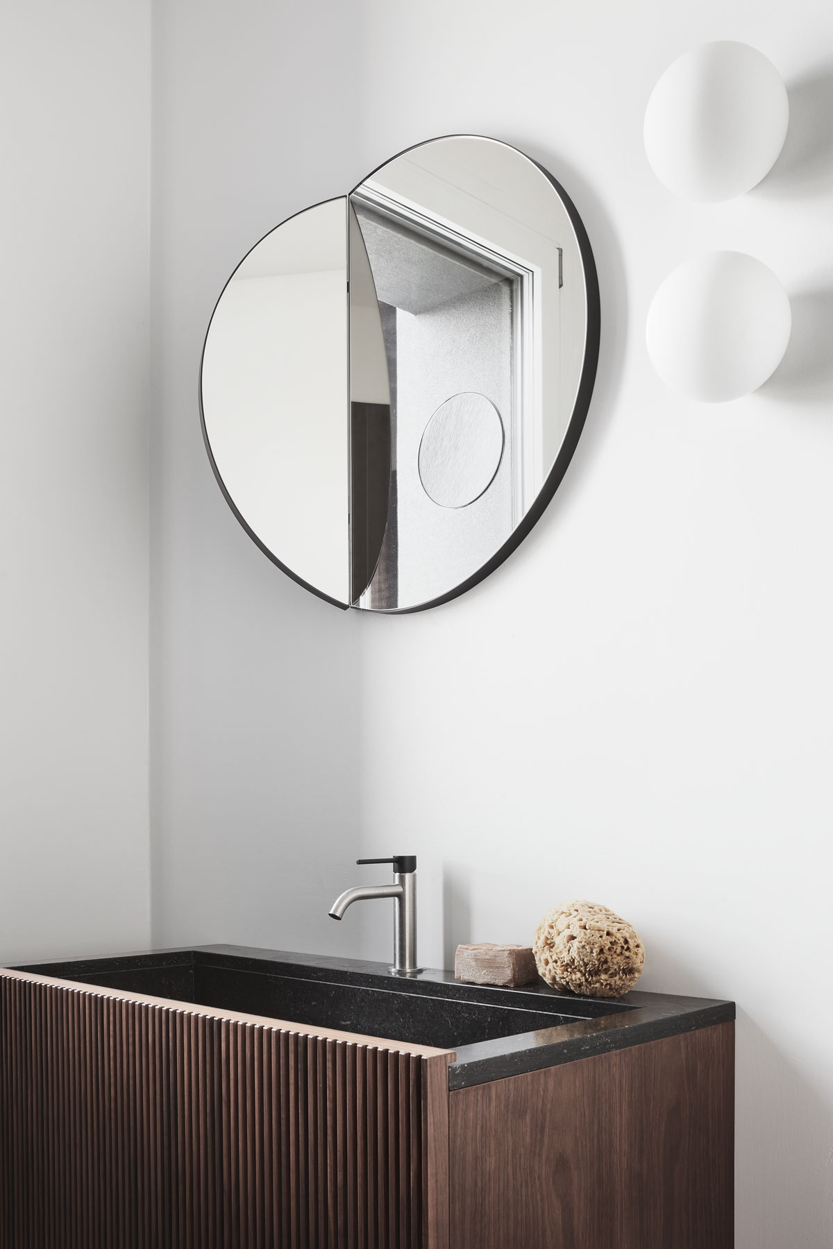 japanese-style washbasins made by natural stone and walnut wood with a circle mirror and accessories