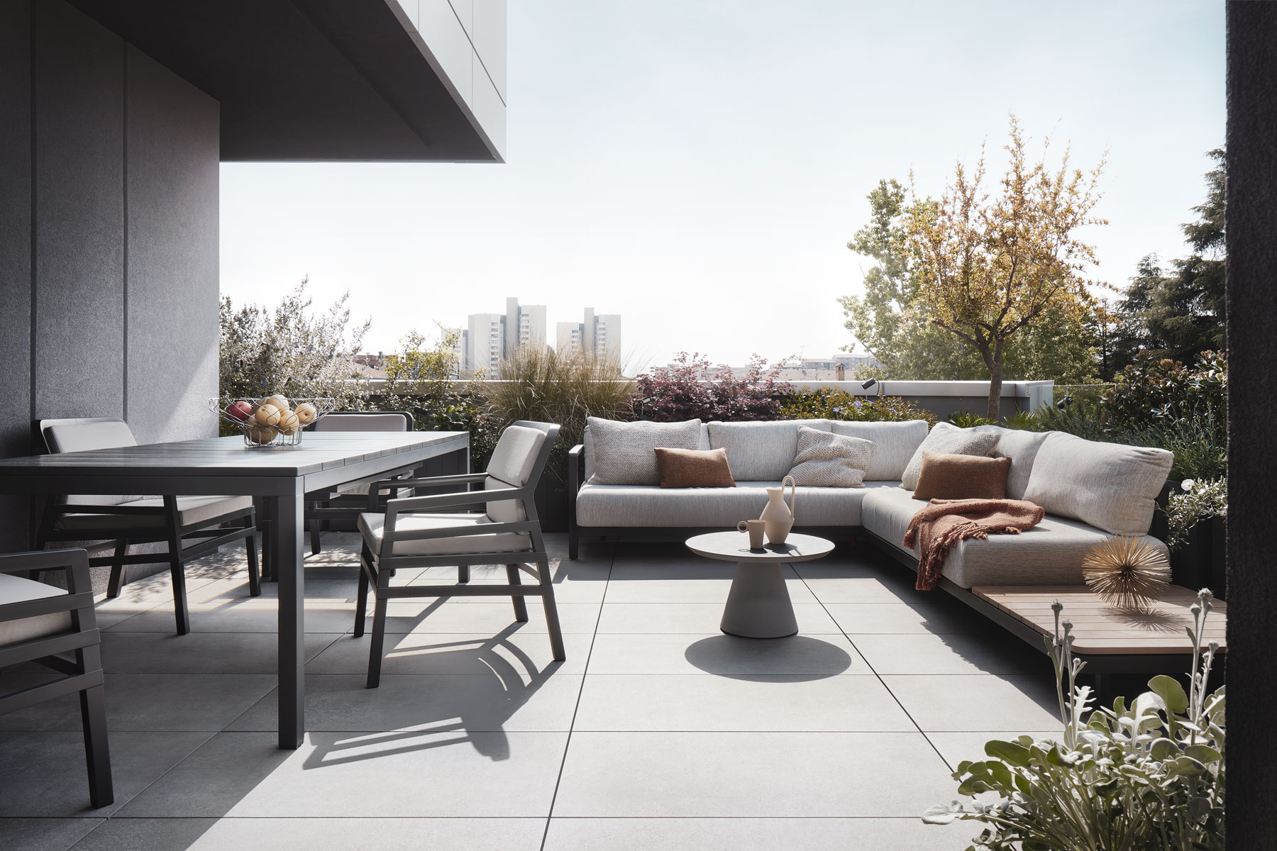 modern penthouse terrace with outdoor furniture and plants